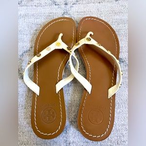 Tory Burch white strap sandals with gold small emblem throughout W8